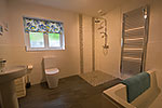downstairs bathroom with wetroom shower and bath